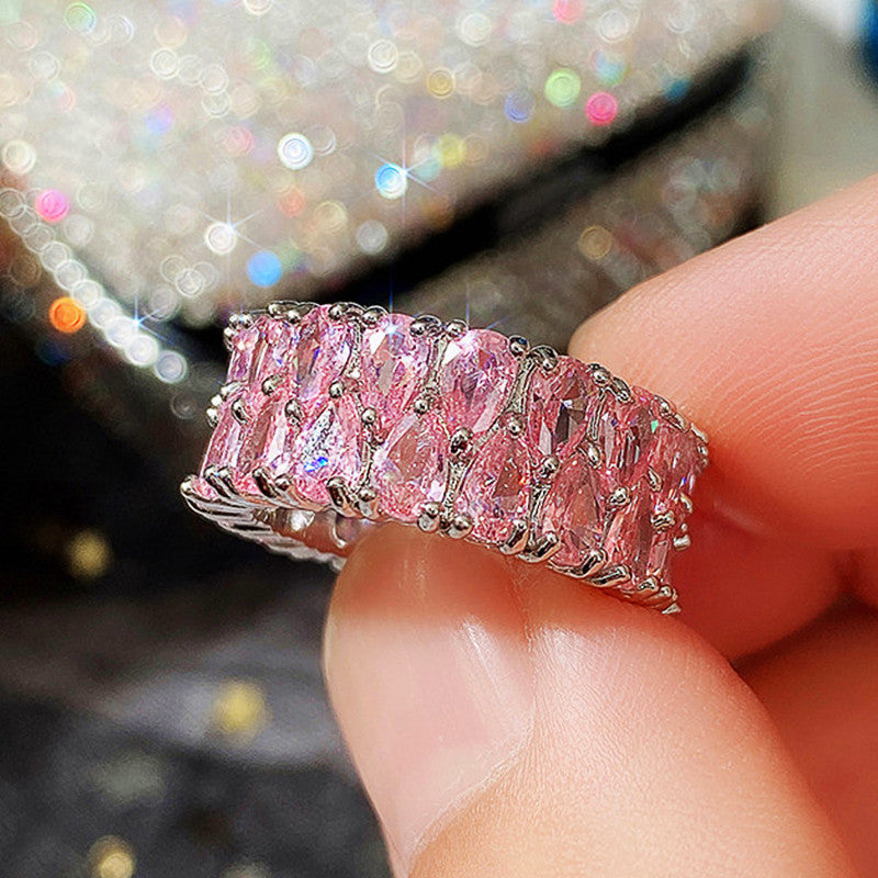 ZEVORA Blush Cascade Eternity Ring – Handmade White Gold & Pink Sapphire Jewelry